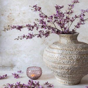 The ABIGAIL AHERN ONCIDIUM ORCHID is a single artificial stem featuring sparse small purple flowers and buds on delicate branches, presented against a plain white background.