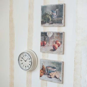 The CREATIVE COOP CANVAS STILL LIFE WITH FRUIT OR VEGETABLES features a blue and white bowl with a spoon, pears, and an apple on a light background—ideal for kitchen wall art or farmhouse décor.