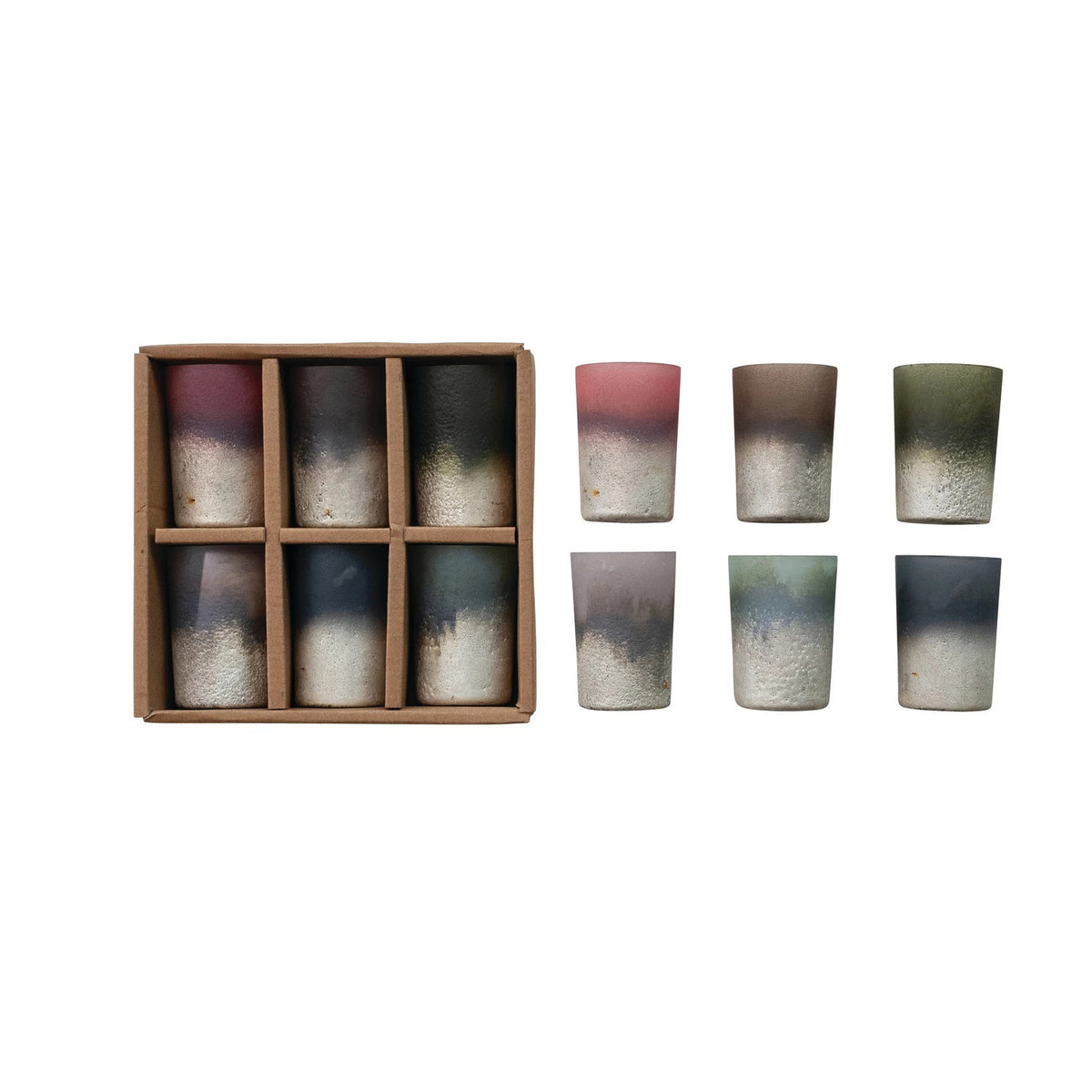 The CREATIVE COOP FROSTED GLASS TEALIGHT HOLDER is shown on a white background, featuring earthy ombre tones like pink, green, blue, and gray—perfect to pair with gradient ceramic cups. Boxed in cardboard for gifting.