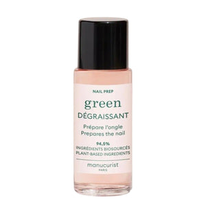 A 30ml bottle of MANUCURIST - GREEN™ DEGREASER nail prep from MANUCURIST INC, formulated with gentle, effective plant-based ingredients. The clear bottle features a black cap and a white label with green and black text.