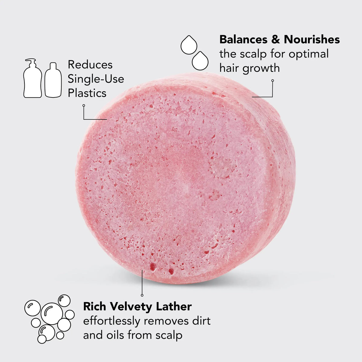 The pink KITSCH - CASTOR OIL SHAMPOO BAR is 3.2 oz (91g) of eco-friendly, color-safe, pH-balanced, vegan, and plastic-free hair care. Ideal for those seeking balance and sustainability with its "Nourishing Solid Shampoo" label for a well-balanced scalp.