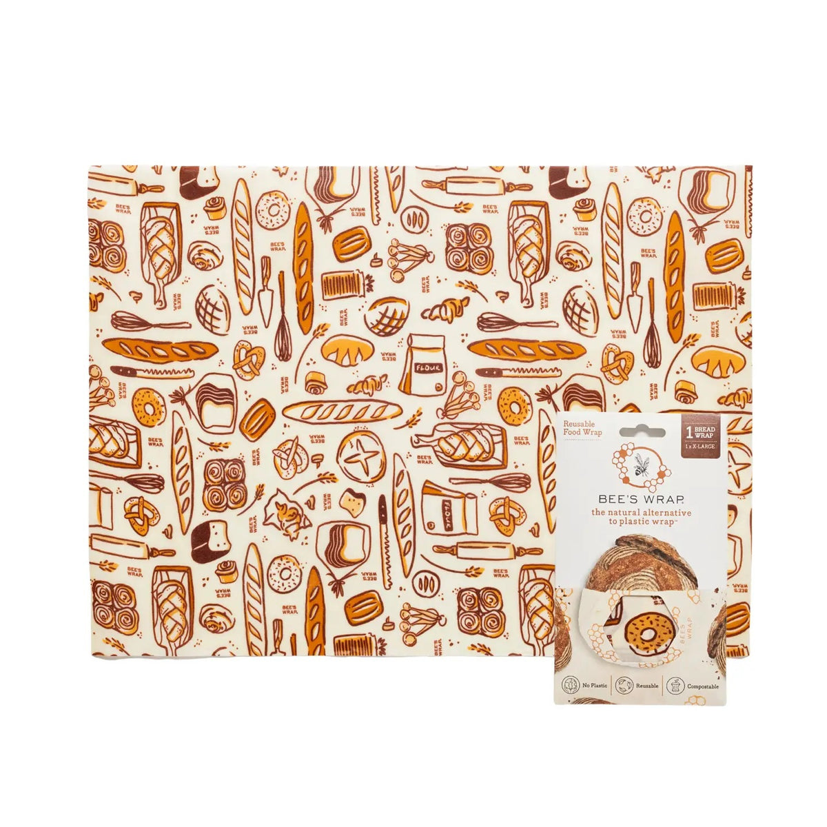 A loaf of bread is partially tucked inside the BEES WRAP- BEESWAX REUSABLE BREAD BAKERY LANE bag by BEES WRAP, featuring a small white label and displayed against a plain white background—a perfect choice for a plastic-free kitchen.