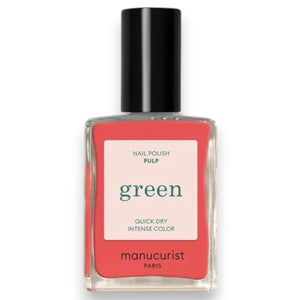 A bottle of MANUCURIST INC’s GREEN™ Nail Polish in the shade “Pulp,” showcasing a vibrant coral hue, with a sleek black cap and a label that reads “green quick dry intense color,” made using bio-sourced ingredients.