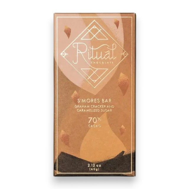 A RITUAL CHOCOLATE - SMORES CHOCOLATE BAR 70% by RITUAL CHOCOLATE, in brown with gold geometric accents and "Graham Cracker and Caramelized Sugar, 70% Cacao" on the label, evokes classic campfire s’mores in every bite.
