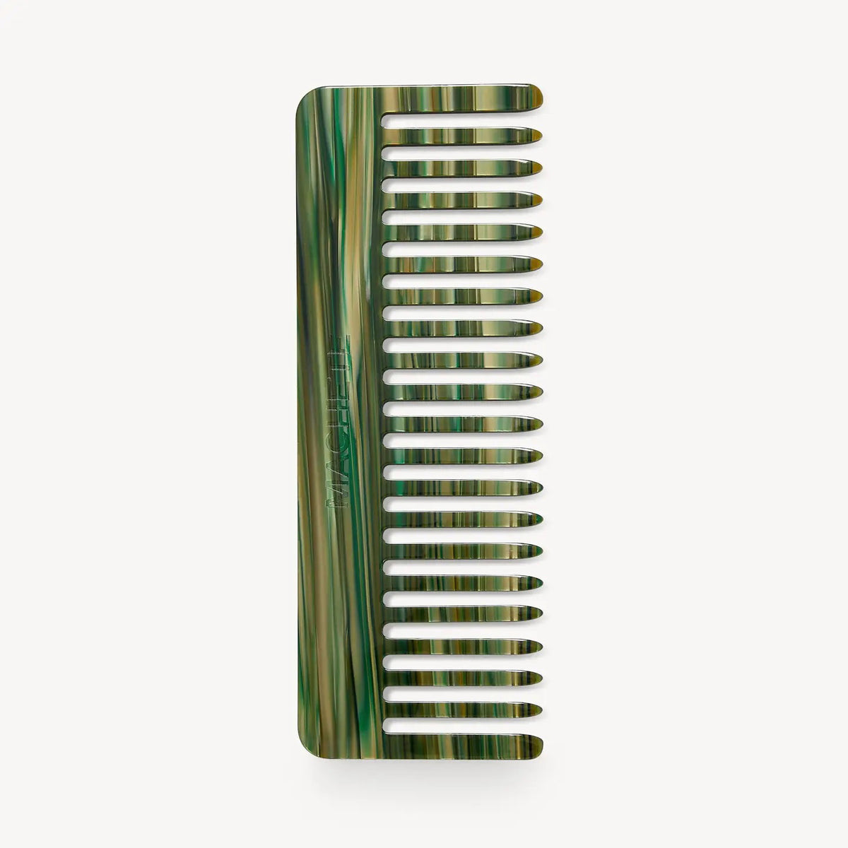 The MACHETE - NO. 2 COMB IN MEADOW is a wide-tooth, handcrafted Italian acetate comb with a marbled green and beige pattern, displayed vertically against a plain white background.
