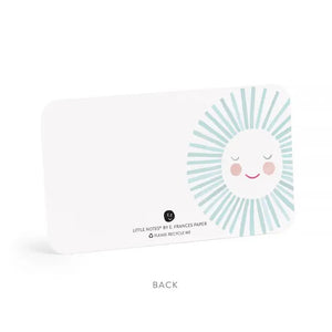 The E. FRANCES - LITTLE NOTES BLUE SUNSHINE mini card features a smiling, hand-painted watercolor sun with a white face, pink cheeks, closed eyes, and light blue rays. Text below: "Little Notes by E. Frances Paper. Please Recycle Me.