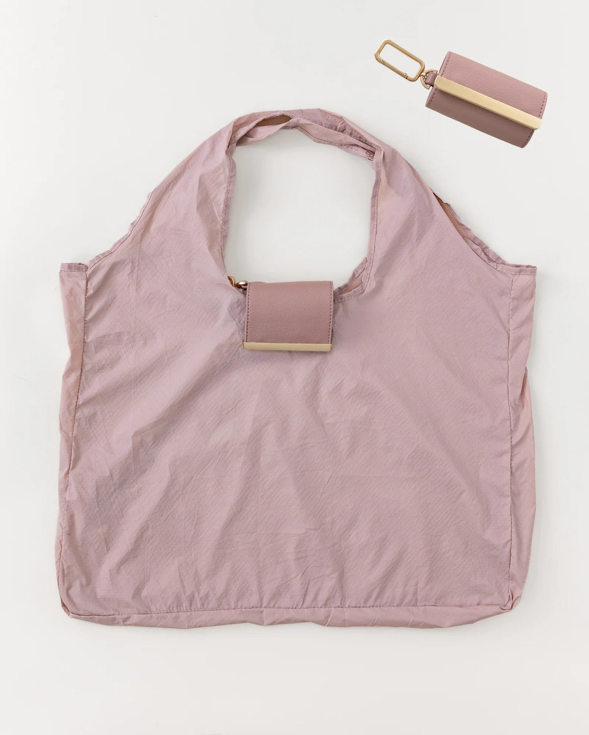 The KEOTE Keychain Tote in Blush is a light pink compact tote bag paired with a matching rectangular pouch, displayed together and separately against a white background.