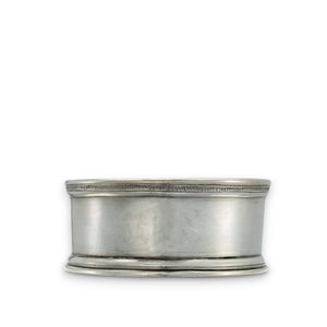 The MATCH Pewter Bottle Coaster with Wood Insert by MATCH features a smooth, round pewter design with subtle engraved lines and a wood insert, crafted from food-safe materials and shown against a white background.