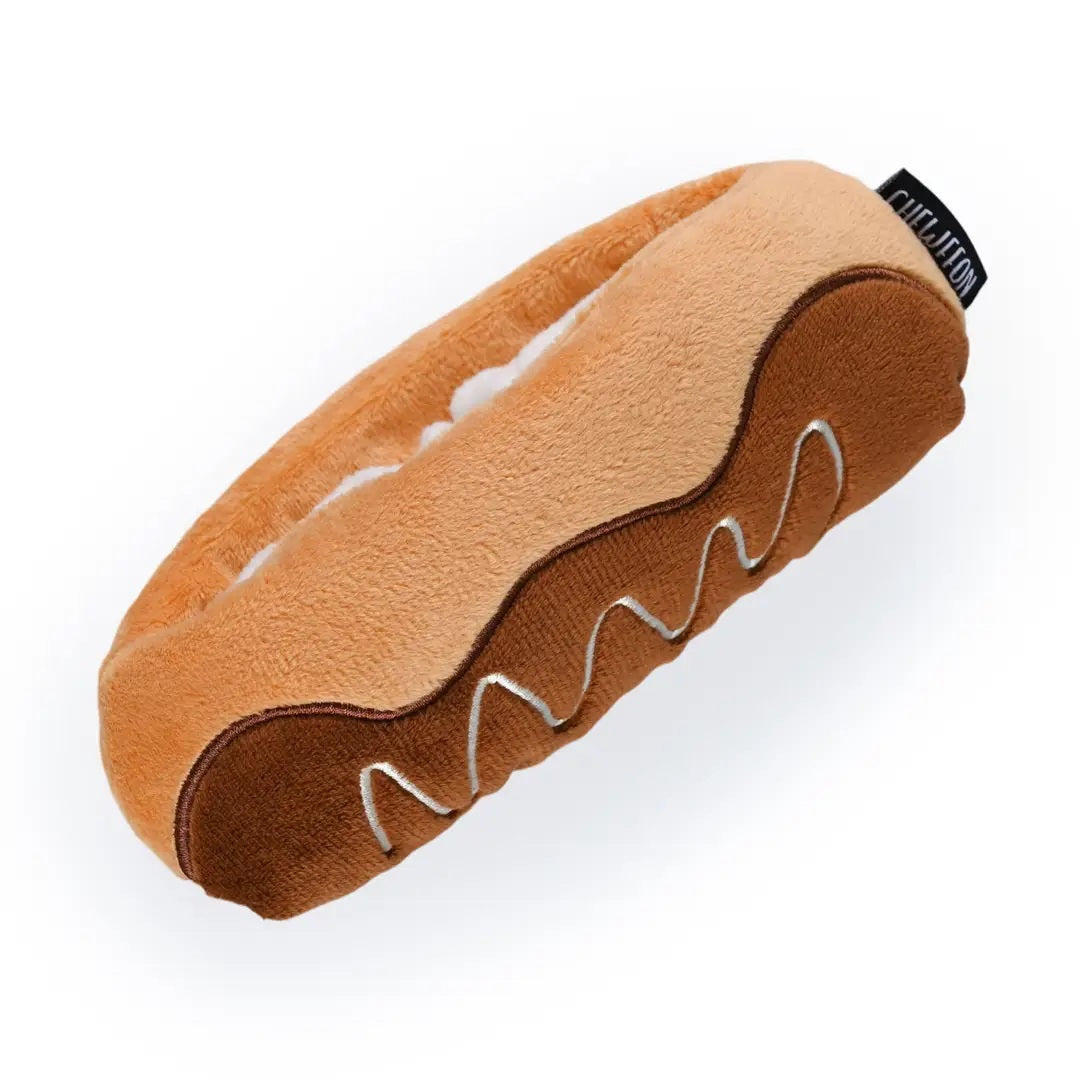 Introducing the CHOCOLATE ÉCLAIR SNUFFLE &amp; CRINKLE DOG TOY from CHEWFFON—a plush, pastry-inspired enrichment toy featuring a soft white interior. This interactive dog toy is gentle on noses and designed for hiding small, colorful treats, encouraging your pup to sniff and search for rewards.