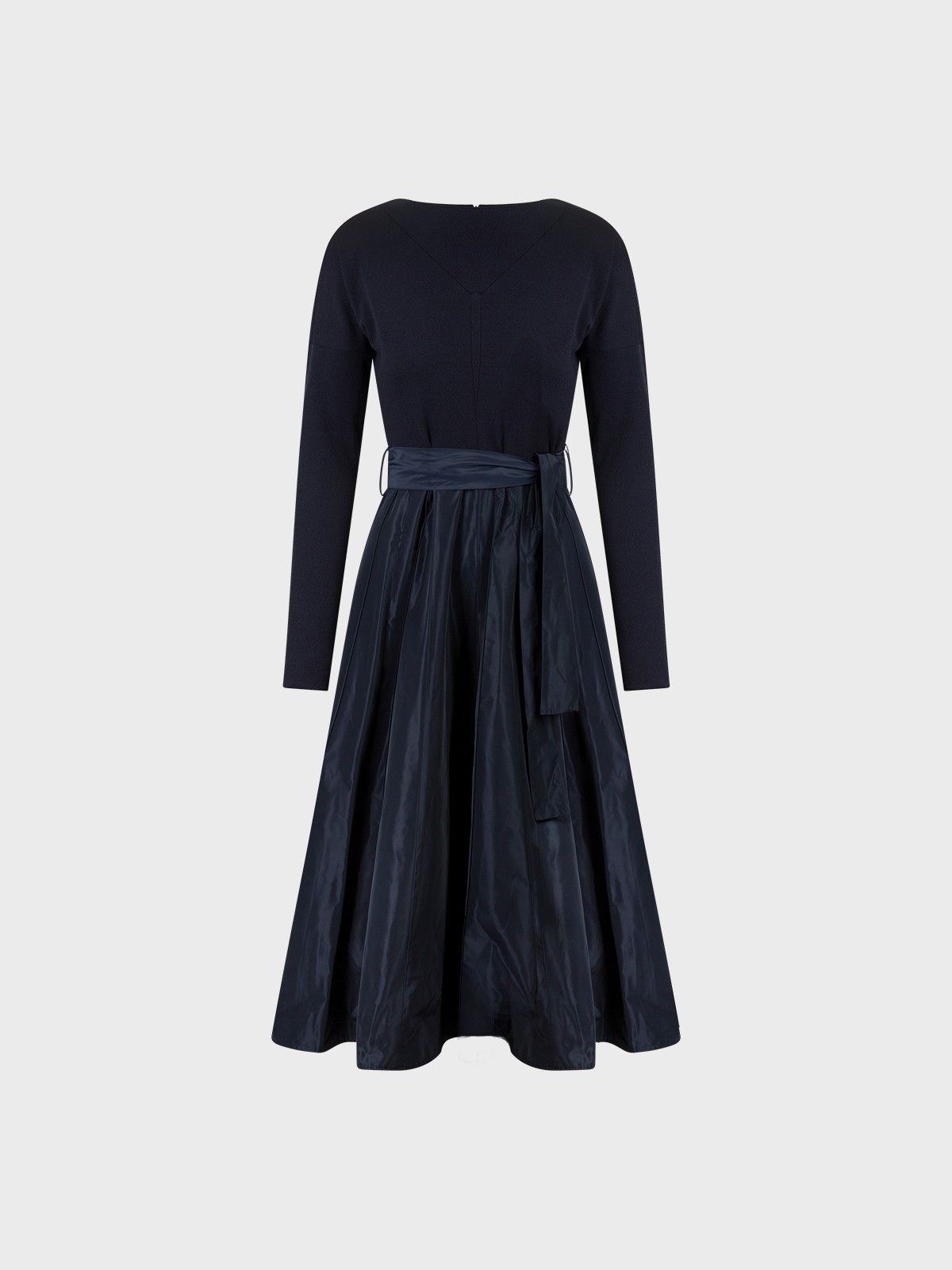 The SANDRO FERRONE JERSEY AND TAFFETA DRESS features long sleeves, a fitted knit bodice, belted waist tie, and a shiny navy blue A-line midi taffeta skirt, displayed on a plain light gray background.