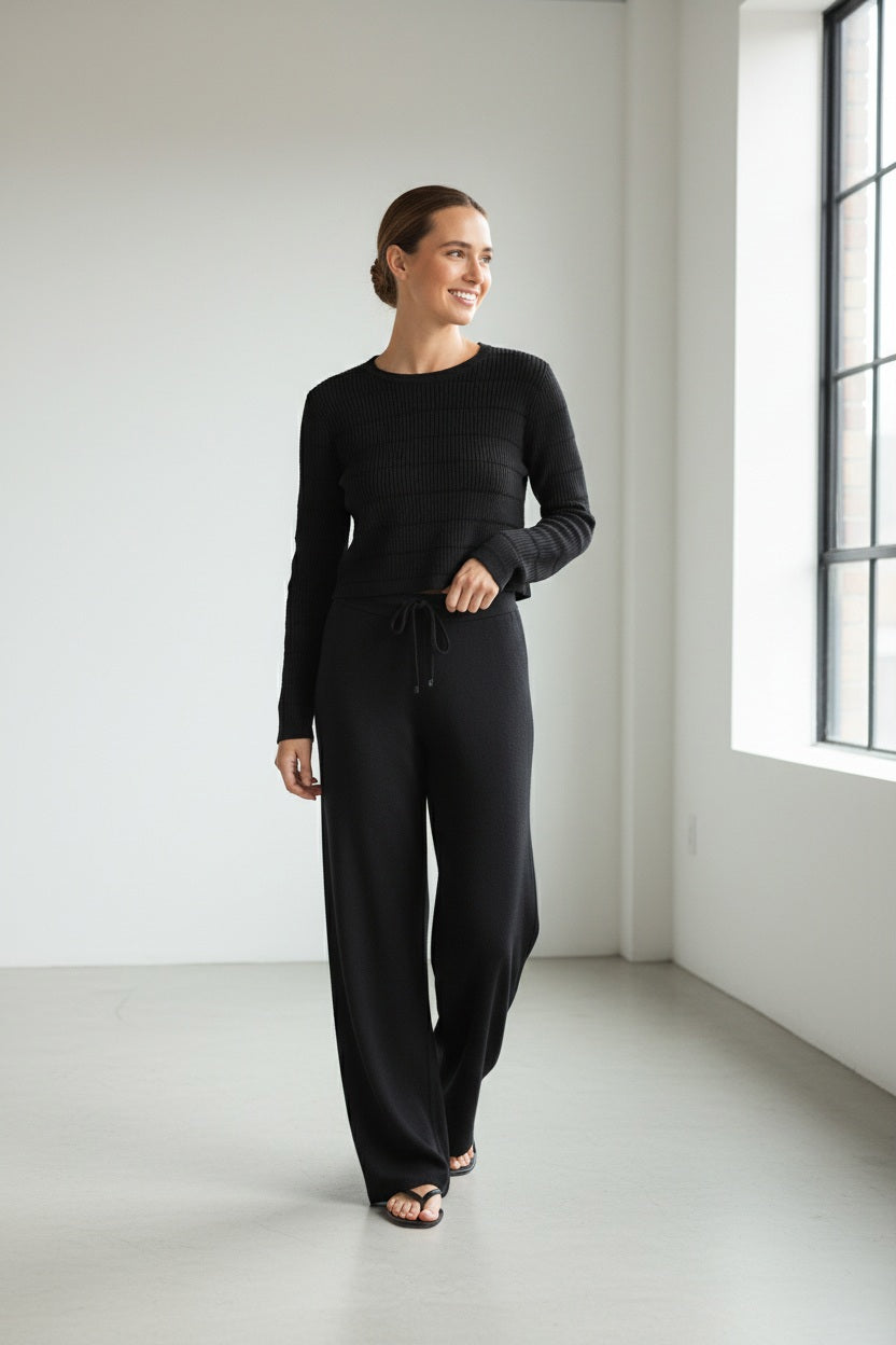 The KINROSS CASHMERE Doubleknit Lurex Drawstring Pant in black features a straight-leg silhouette and luxe cashmere blend for comfortable loungewear, shown on a plain white background.