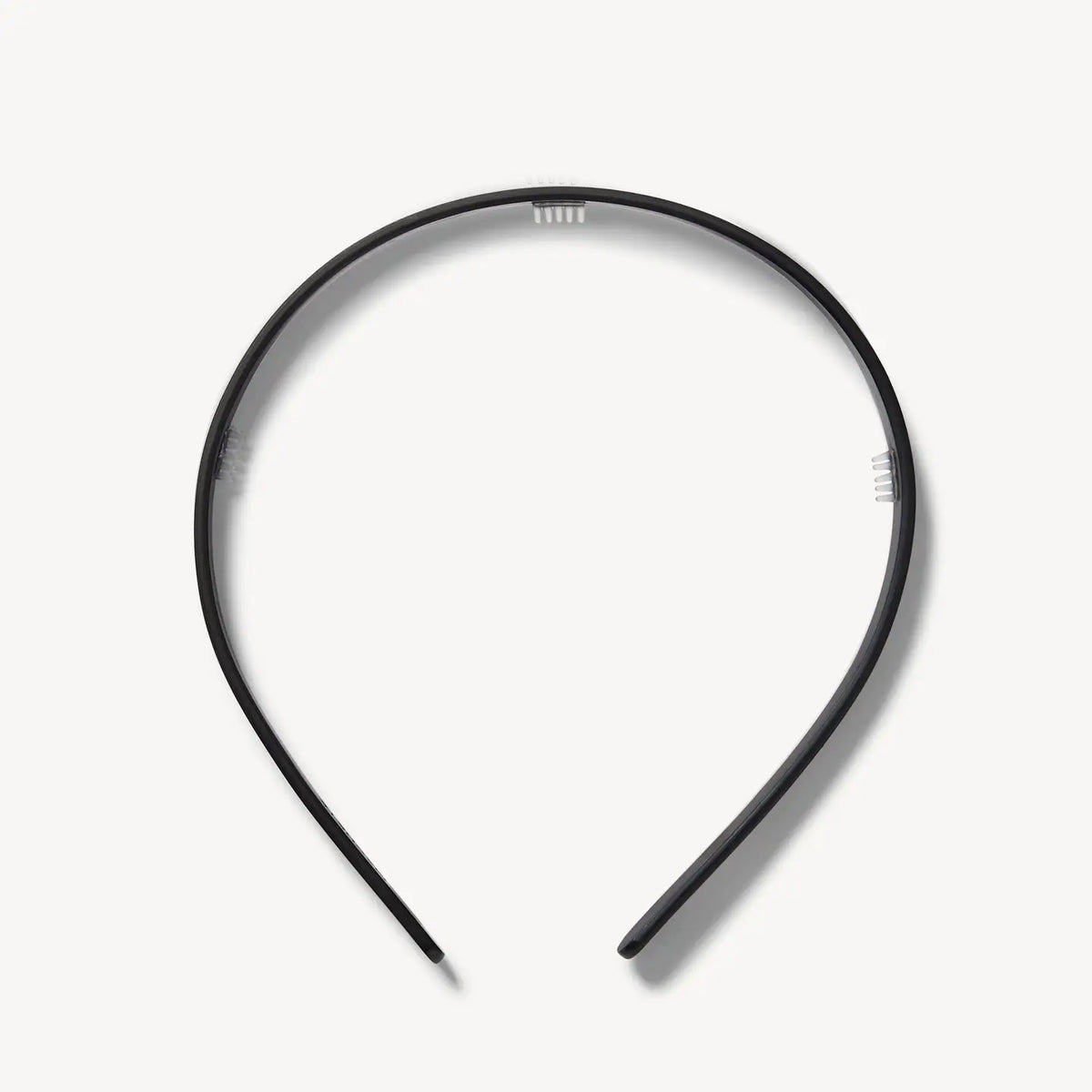 The MACHETE Ultralight Thin Headband in Matte Black is a simple, lightweight accessory crafted from hand-polished Italian acetate, displayed on a plain white background.