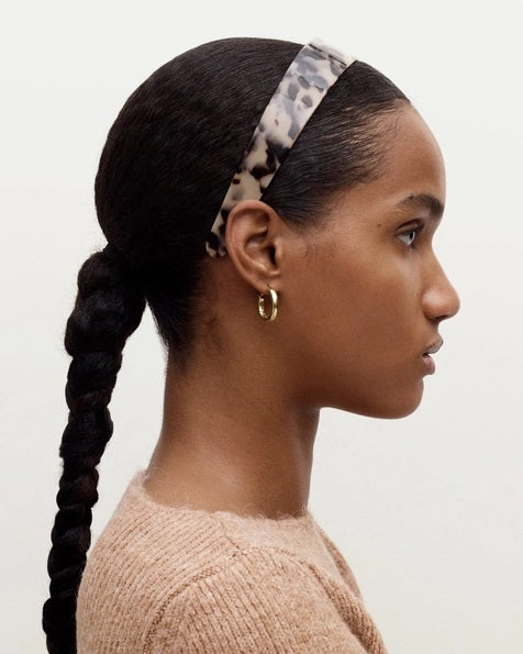 The MACHETE - Wide Headband in Midnight Horn features a glossy, black and gray marbled Italian acetate design and is displayed on a white background.