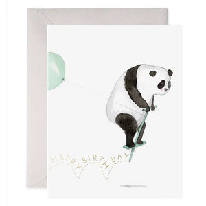 The E. FRANCES - POGO PANDA greeting card by E. FRANCES PAPER features a panda on a pogo stick with a green balloon and “Happy Birthday” below, printed on heavyweight paper and paired with a grey envelope behind the card.