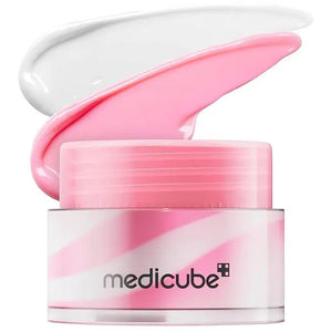 A jar of GLOWISS MEDICUBE - PDRN LIP SLEEPING MASK GLOW BALM features a pink and white swirl design, displayed with a moisturizing dollop of the pink and white balm above the open container.