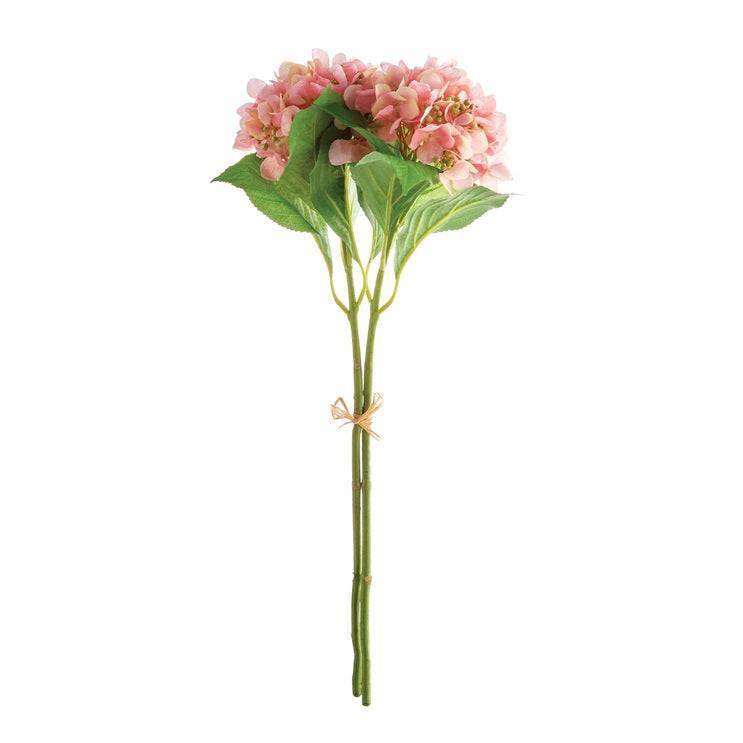 The NAPA HOME AND GARDEN Hydrangea Stem features pink hydrangea blooms and green leaves, tied with twine. Its long, slender stems stand upright against a white background, offering a realistic faux flower aesthetic, ideal for home decor.