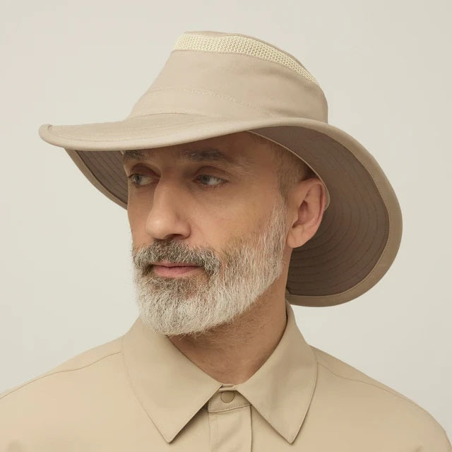 A man with a gray beard wears the TILLEY - AIRFLO HIKERS HAT T4MO-1 IN KHAKI OLIVE, featuring UPF 50+ sun protection, and a matching collared shirt, shown in profile against a plain light background.
