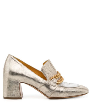 The LEATHER MID HEEL LOAFER WITH CHAIN by MADISON MAISON is a luxurious mid heel loafer crafted in metallic silver leather, showcasing a square toe and an elegant gold chain detail across the top. Featuring a medium height, the handmade Italian craftsmanship is evident in its subtle textured finish.