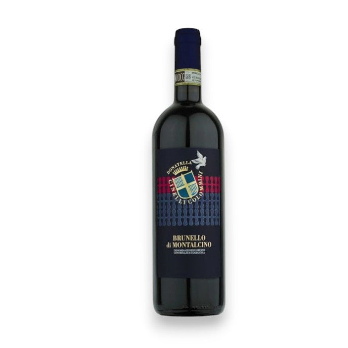 The DONATELLA CINELLI COLOMBINI BRUNELLO DI MONTALCINO 2019 by WINE: AMERICAN PREMIUM BEVERAGE features a dark blue label with a gold and blue emblem. It includes red and silver accents, highlighting its prestigious Sangiovese origins.