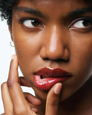 A beige tube of U BEAUTY THE PLASMA LIP COMPOUND 15ML stands upright, featuring white text and logo—ideal for natural lip enhancement and plumping treatment.