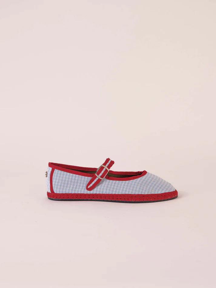 A single SVETI STEFAN - MARY JANE SHOE with a buckle strap, handmade in Spain, is displayed on a plain light background. The shoe features a dark pink body with lighter pink trim and a light pink sole, all crafted from cotton fabric.