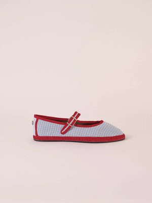 A single SVETI STEFAN - MARY JANE SHOE with a buckle strap, handmade in Spain, is displayed on a plain light background. The shoe features a dark pink body with lighter pink trim and a light pink sole, all crafted from cotton fabric.