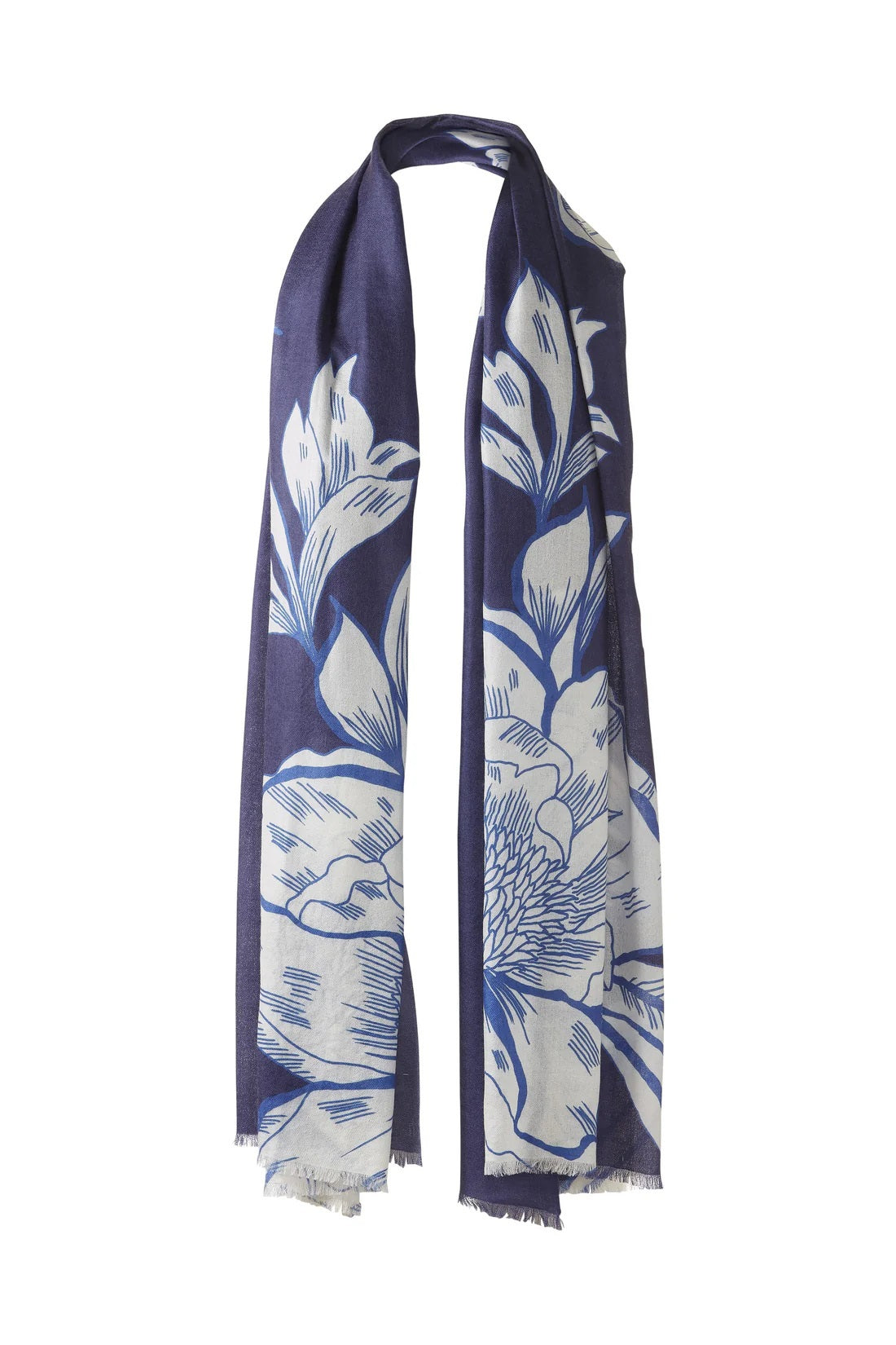 The KINROSS CASHMERE - OVERSIZED BLOOMS CASHMERE SCARF by KINROSS is a light blue cashmere scarf with a cream floral print, soft lightweight feel, and unfinished fringe edges, styled in a loop as if hung on a hook.