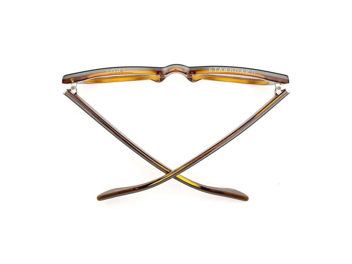 The CADDIS - MIKLOS PROGRESSIVE READERS by CADDIS are black, thick-rimmed rectangular eyeglasses with scratch-resistant lenses and beige inner arms, displayed against a white background.
