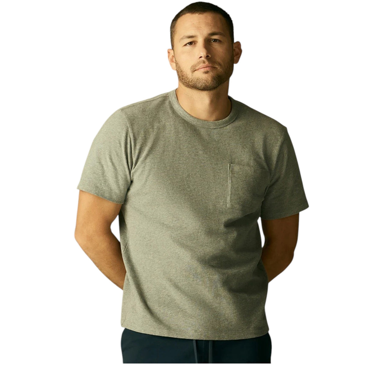 A person wears the MACK WELDON Heavyweight Slub Cotton Pocket T-Shirt in Cactus, a light olive green relaxed fit short-sleeve tee with a chest pocket, shown cropped to the upper torso against a plain white background.