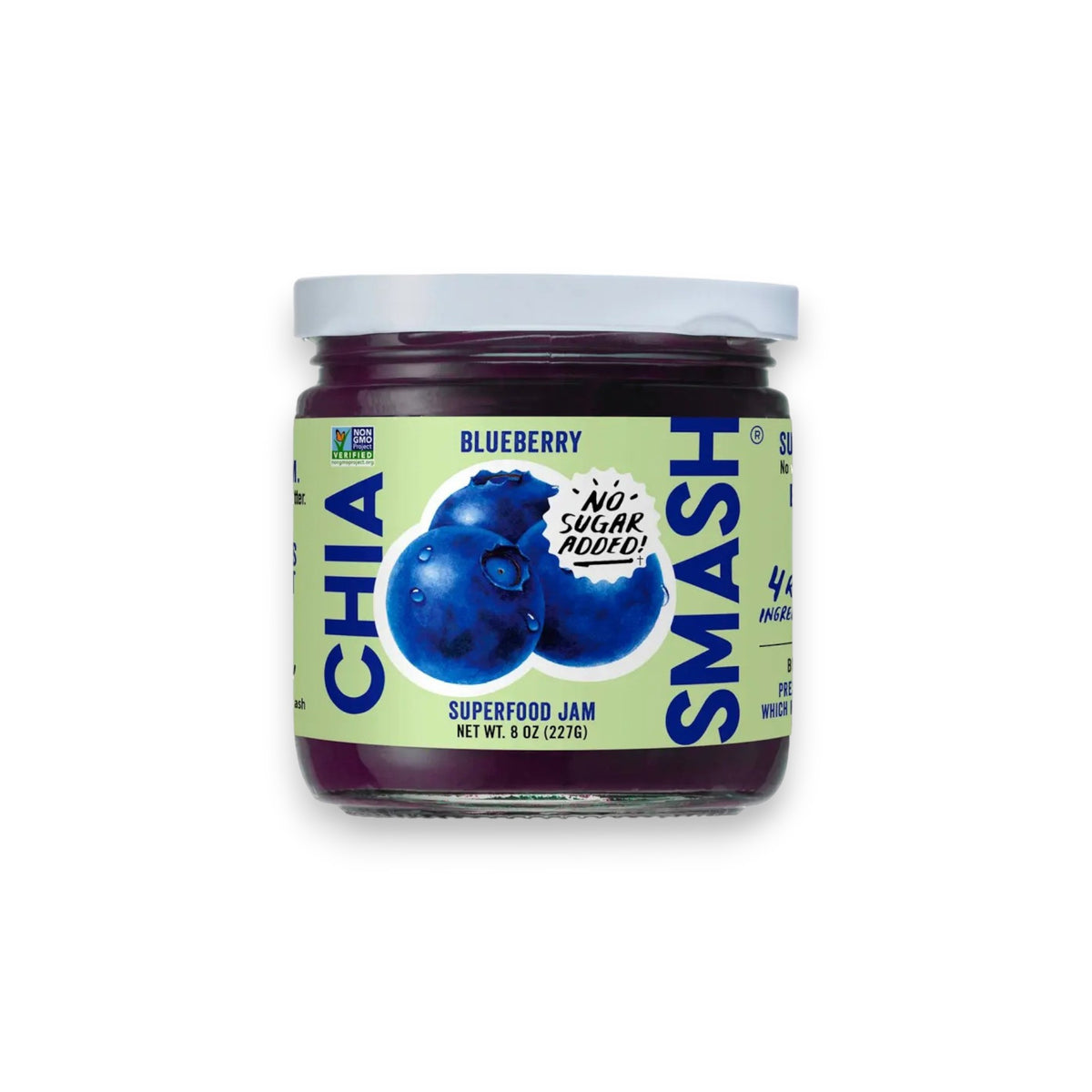 A jar of CHIA SMASH - BLUEBERRY CHIA JAM from the brand CHIA SMASH features a label with two illustrated blueberries and the text &quot;No Sugar Added!&quot; This 8 oz (227g) jar proudly displays its &quot;Non-GMO Project Verified&quot; status and contains just 4 ingredients, making it an ideal zero added sugar jam that is both paleo and vegan friendly.