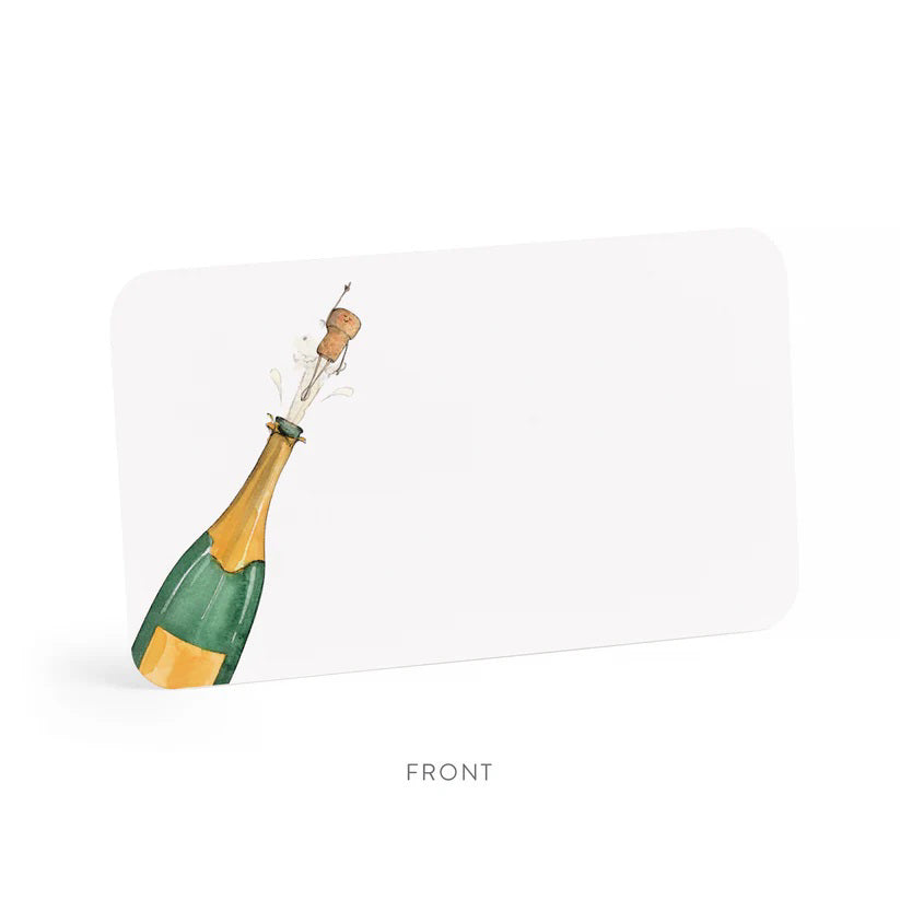 A clear box holds 85 E. FRANCES PAPER - FLYING CORK LITTLE NOTES—small, hand painted notecards from E. FRANCES PAPER, featuring a champagne bottle "flying cork" design. The label reads "E. Frances 85 Little Notes—use unsparingly.