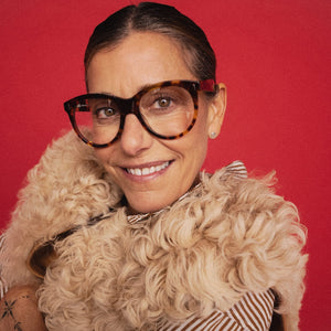 A pair of CADDIS - CHAVELA Progressive Readers in Friar Truck, featuring dark brown thick frames and round, scratch-resistant lenses, viewed from the front against a white background.