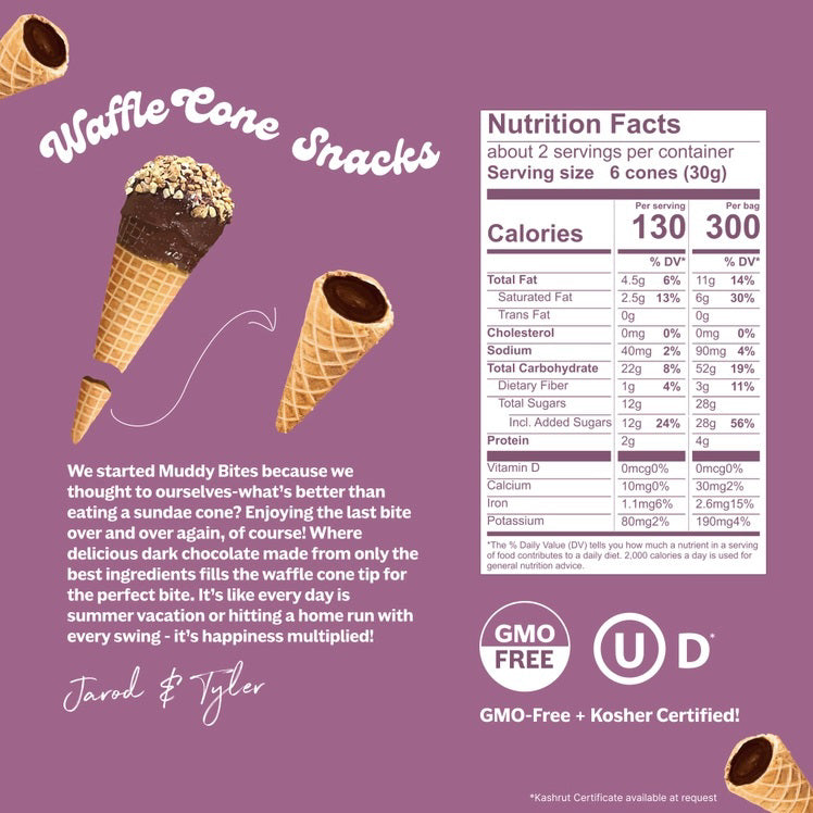 A chocolate-filled waffle cone, MUDDY BITES- DARK CHOCOLATE WAFFLE CONES, is centered against a purple background. Text reads "Creamy Dark Chocolate: Premium delicious dark chocolate made from simple ingredients" with an arrow pointing to the chocolate and "Crunchy Cone: Light crisp cone that blends perfectly with our creamy dark chocolate" with an arrow pointing to the cone. Logos for "GMO Free" and Kosher certification are at