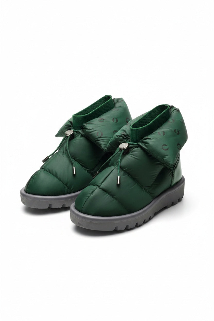 The FLUFIE METALLIC PILLOW BOOT is a pair of gray, insulated slippers with drawstring closures, a high folded collar, water repellent fabric in a subtle circular pattern, designed for warmth and shown on a white background.