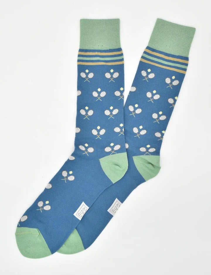 BIRD DOG BAY - ANYONE FOR TENNIS SOCKS IN BLUE by BIRD DOG BAY: Blue mid-calf socks with light green cuffs, heels, and toes, small white tennis rackets and balls, plus two yellow stripes near the top.
