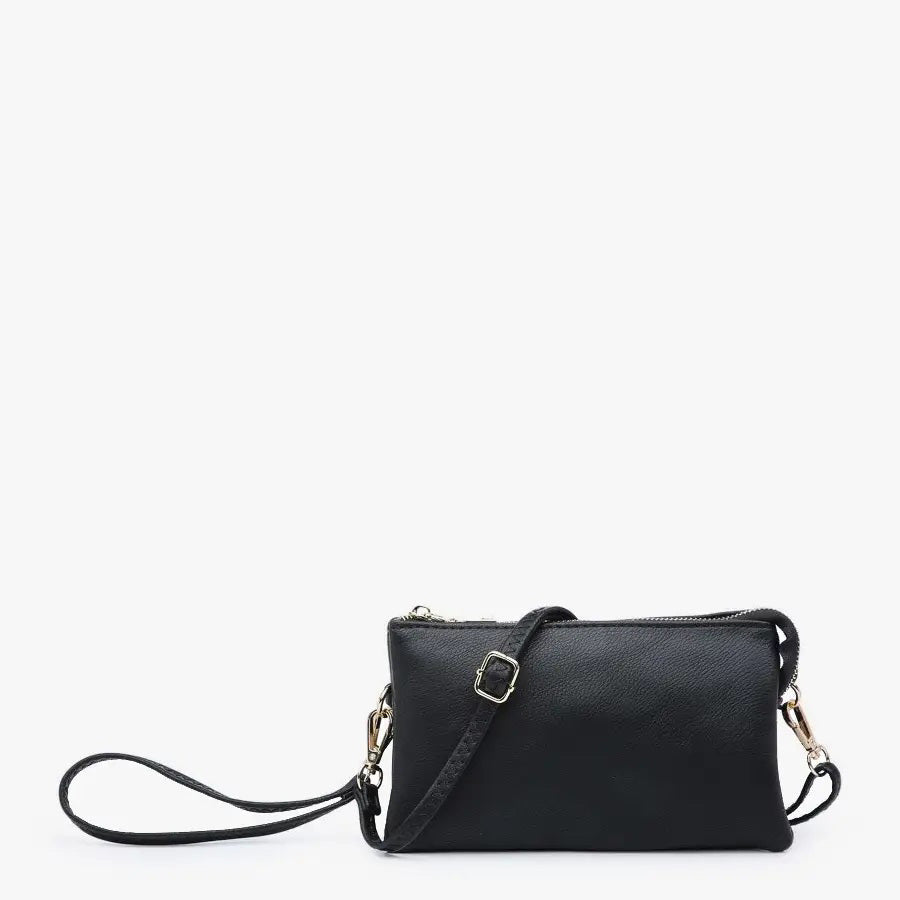 Introducing the JEN &amp; CO 3 COMPARTMENT CROSSBODY WRISTLET: a stylish black wristlet crafted from vegan leather, adorned with elegant gold-tone hardware and equipped with an adjustable strap. The interior features a chic herringbone lining, beautifully displayed against a plain white background.