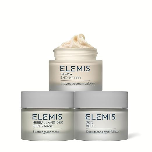 Image of a product package for &quot;KIT DEEP CLEANSING MASK TRIO&quot; by ELEMIS - STEINER. The box is upright with a light blue background and features images of three cream smears in white and light blue. Text details product information and benefits in English and French to exfoliate, purify, and brighten your skin.