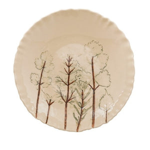 Two views of the CREATIVE COOP HAND-PAINTED ORGANIC SHAPED STONEWARE LOW BOWL WITH BOTANICALS: one features botanical artwork of trees inside, while the other shows its scalloped, organic-shaped edge.