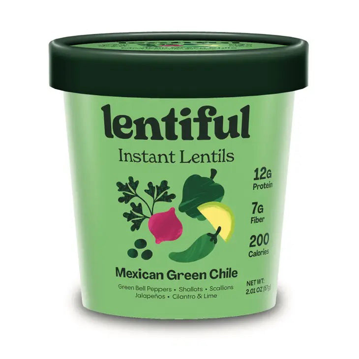 A container of LENTIFUL - MEXICAN GREEN CHILE INSTANT LENTILS is surrounded by fresh ingredients including green bell peppers, jalapeños, limes, cilantro, garlic cloves, onion slices, and green peas—all arranged on a vibrant green background.