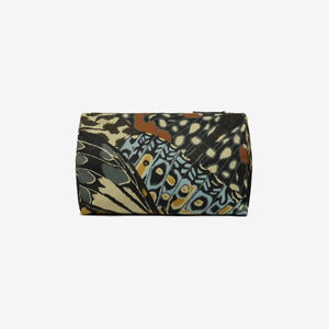 The INOUI EDITIONS PAPILLON Nylon Cosmetic Case by INOUI is a lightweight zippered pouch made from recycled polyester, showcasing a vibrant geometric pattern and bold butterfly motif, displayed on a plain white background.