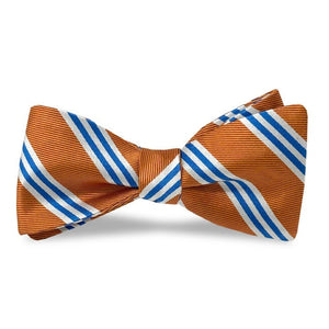 The BIRD DOG BAY - ON AIR STRIPE SILK BOW TIE IN ORANGE AND BLUE, a luxurious silk self-tie bow tie handmade in the USA, features vibrant orange with diagonal blue and white stripes and is neatly tied against a plain white background.