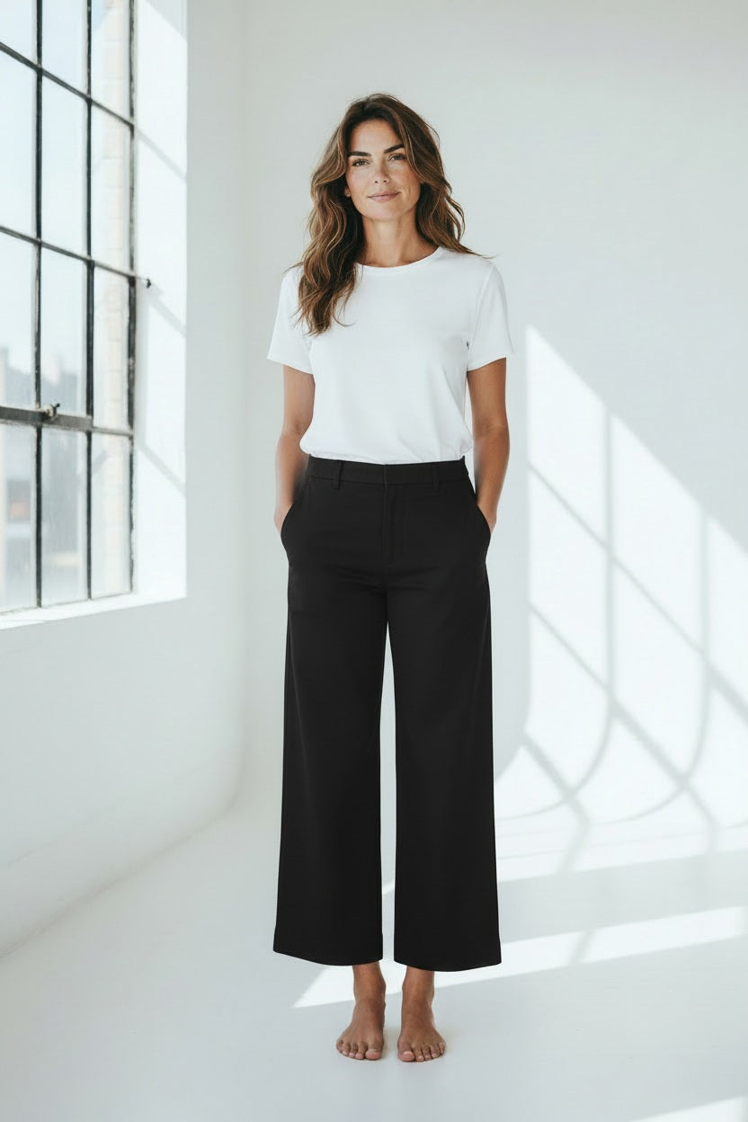 A pair of dark gray, wide-leg chinos from FRANK &amp; EILEEN's Westport collection, made with performance twill. They feature belt loops and a front button closure, designed for a mid-rise fit. Inside the waistband is a "FRANK &amp; EILEEN" label.