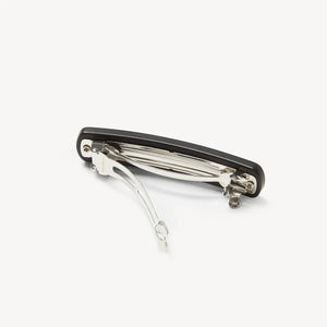 The MACHETE No. 3 Heirloom Barrette in Black Matte is a simple, handmade rectangular hair accessory with rounded edges, crafted from cellulose acetate and displayed against a plain white background.