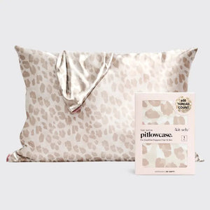 A beige leopard print KITSCH - SATIN PILLOWCASE by KITSCH is displayed with packaging emphasizing its frizz-free, 100% premium satin finish and 600 thread count, ideal for hair and skin benefits.