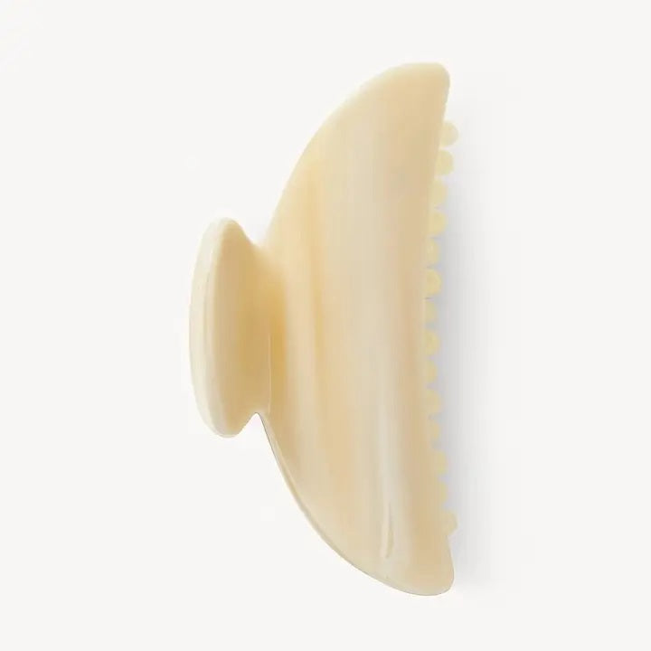 The MACHETE - MIDI HEIRLOOM CLAW by MACHETE is a pink and orange marbled hair claw clip, expertly crafted from premium Italian acetate. It features a curved design, wide grip, and interlocking teeth for a secure hold—ideal for medium volume hair. Shown against a plain white background.