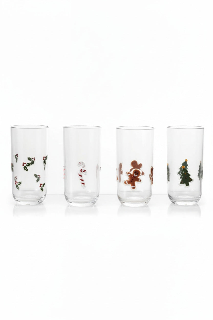 Four clear DRINKING GLASS WITH HOLIDAY ICONS decorated with holly, candy canes, gingerbread men, and Christmas trees.