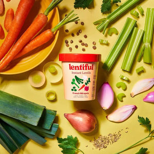A container of LENTIFUL - FRENCH MIREPOIX INSTANT LENTILS by LENTIFUL, with a red lid and vegetable images. Each serving provides 12g protein, 6g fiber, and 200 calories. The lentils feature a Mirepoix flavor with French-style seasoning.
