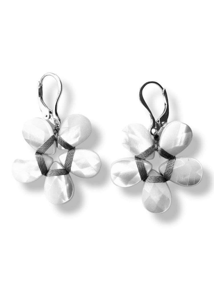 The ANN LIGHTFOOT - MOTHER OF PEARL FLOWER EARRING by ANN LIGHTFOOT features lever-back hooks and a five-petal flower design with a textured, sterling silver surface.