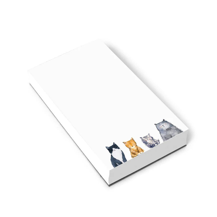 E. FRANCES PAPER's CATS NOTEPAD, made in the USA, features a minimalistic design with recycled paper and charming illustrations of black &amp; white, orange, gray, and brown cats along the bottom edge. The crisp white background offers ample blank space.