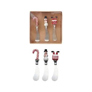 The CREATIVE COOP CANAPE KNIVES WITH HOLIDAY MOTIF boxed set includes three stainless steel knives, each with a festive handle—a candy cane, snowman, and Santa’s legs—shown in the box and separately on a white background.